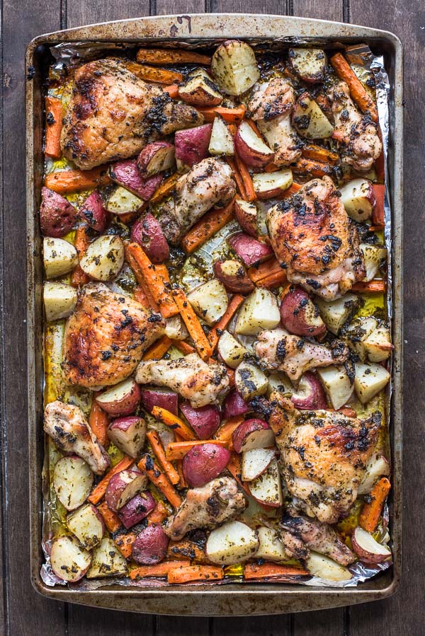Make your entire dinner on a single sheet pan with this killer Pesto Chicken with Potatoes and Carrots.