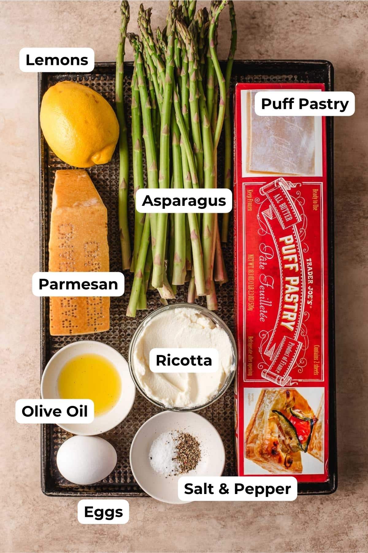 Puff pastry, asparagus spears, lemon, parmesan, olive oil, ricotta, egg, and salt and pepper.