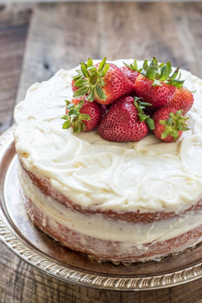 This lovely and easy Strawberry Layer Cake is made in a jiffy and has the best cream cheese frosting! It's a summer dessert staple!