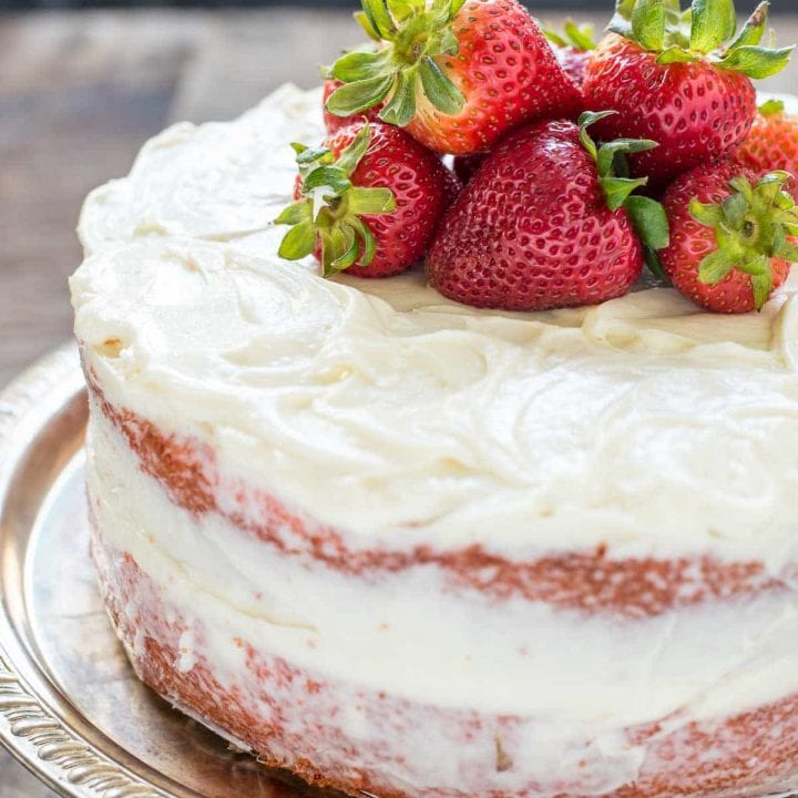 This Easy Strawberry Cake recipe is a lovely summer dessert with the best cream cheese frosting!
