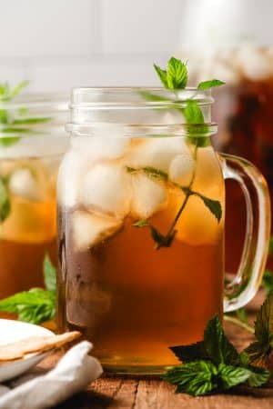 Mint Iced tea served in a glass mason jar, with a mint sprig garnish.