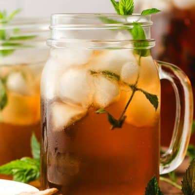 Mint Iced tea served in a glass mason jar, with a mint sprig garnish.