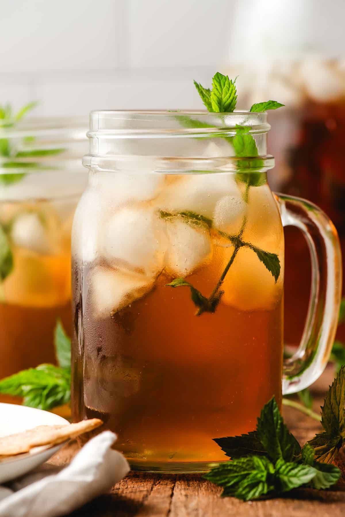 Mint Iced tea served in a glass mason jar, with a mint sprig garnish.