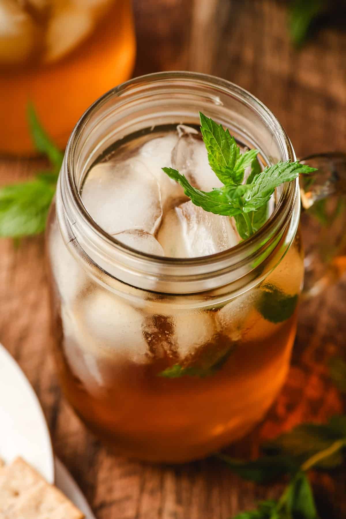 Glass of iced mint tea in a mason jar.