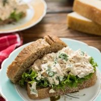Bursting with fresh basil, lemon juice, and Parmesan cheese, these Basil Chicken Salad Sandwiches taste like summer.