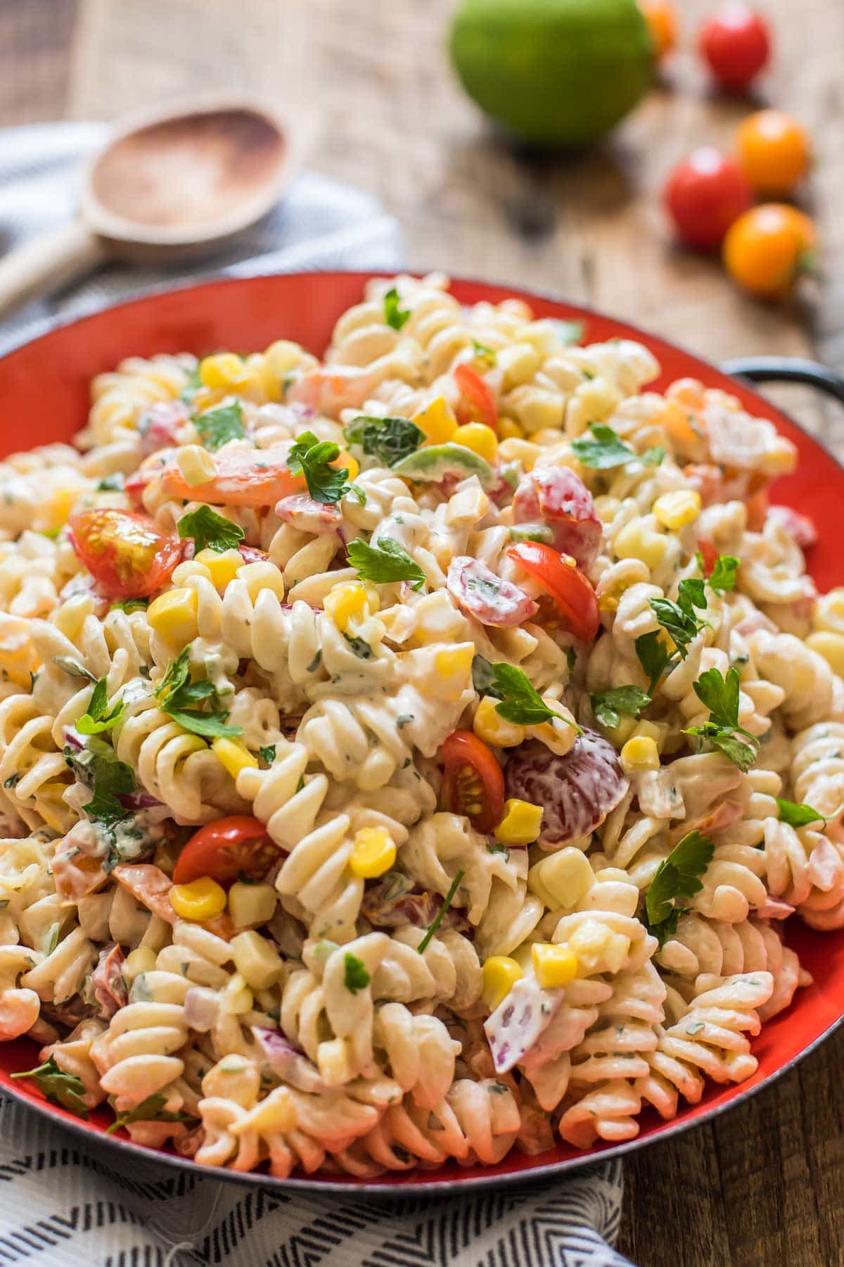 Packed with lime, cilantro, jalapeno, and fresh summer veggies this Southwest Pasta Salad is a hit at summer BBQs.