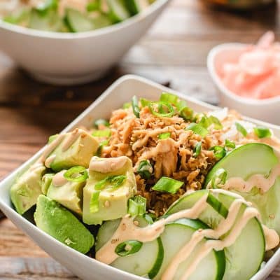 Tuna sushi bowl with avocado, cucumbers, and spicy mayo.