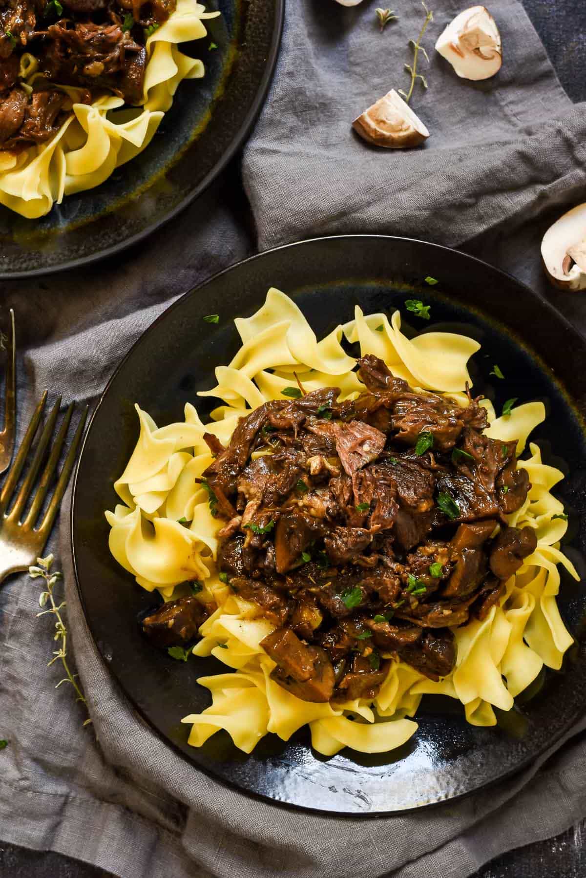 Serve this Red Wine Pot Roast with Mushrooms over egg noodles for a super comforting, hearty weeknight meal. 
