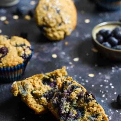 These Blueberry Oatmeal Muffins bursting with blueberries and made with Greek yogurt, coconut oil, and oats are a hearty, healthy way to start the day. They freeze great too!