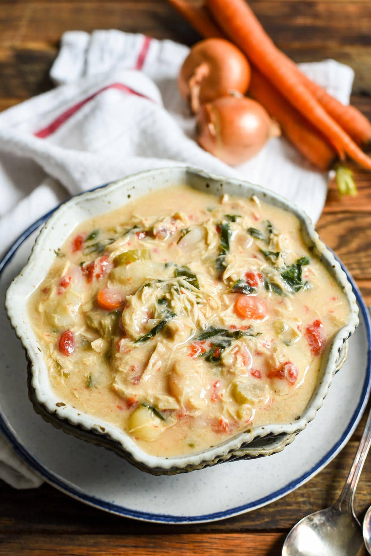 This creamy Crock Pot Chicken Gnocchi Soup has everything you need for a healthy weeknight meal all made in a slow cooker!@