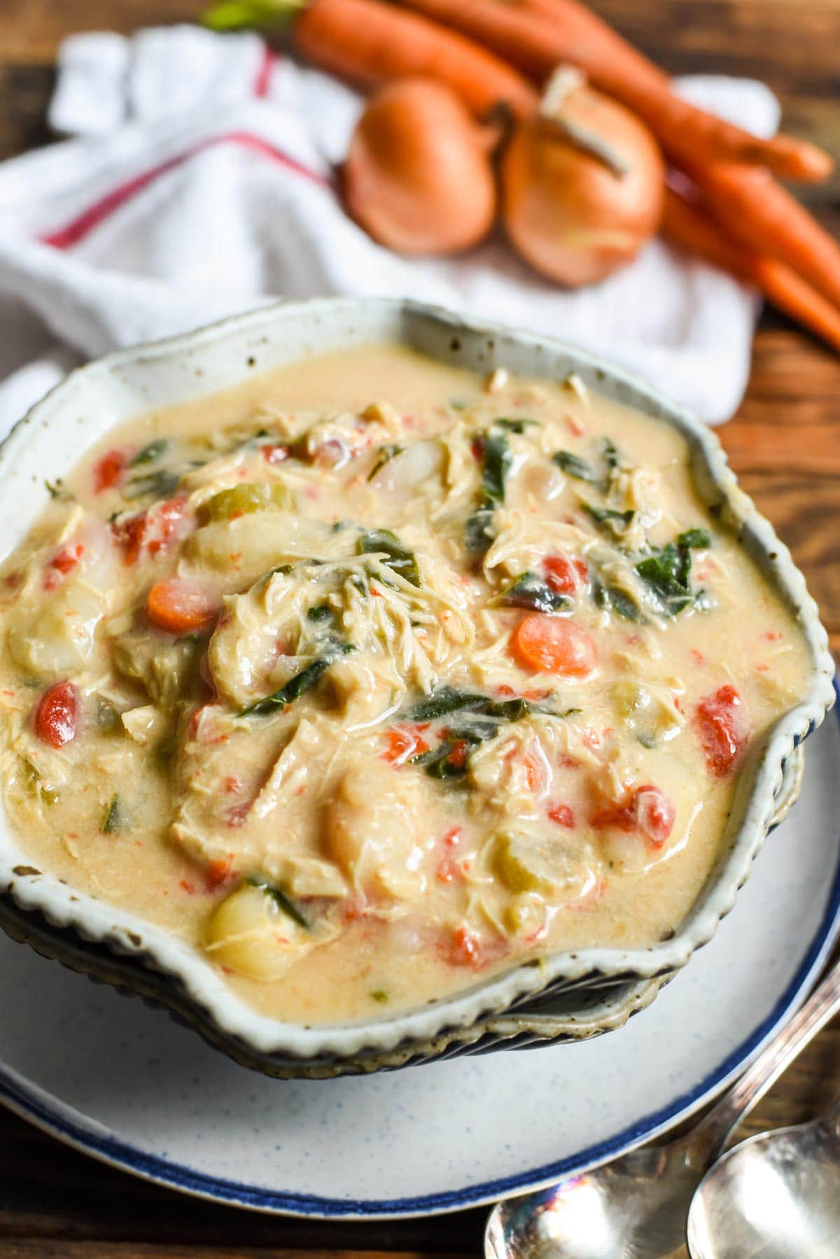 This Crock Pot Chicken Gnocchi Soup is loaded with roasted red peppers, garlic, carrots, and chard in a creamy base.