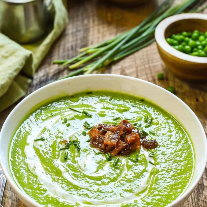 Green Pea Soup with smoky sweet candied bacon is a party for your tastebuds! Light, but creamy, sweet and salty, it's perfect for any spring meal!