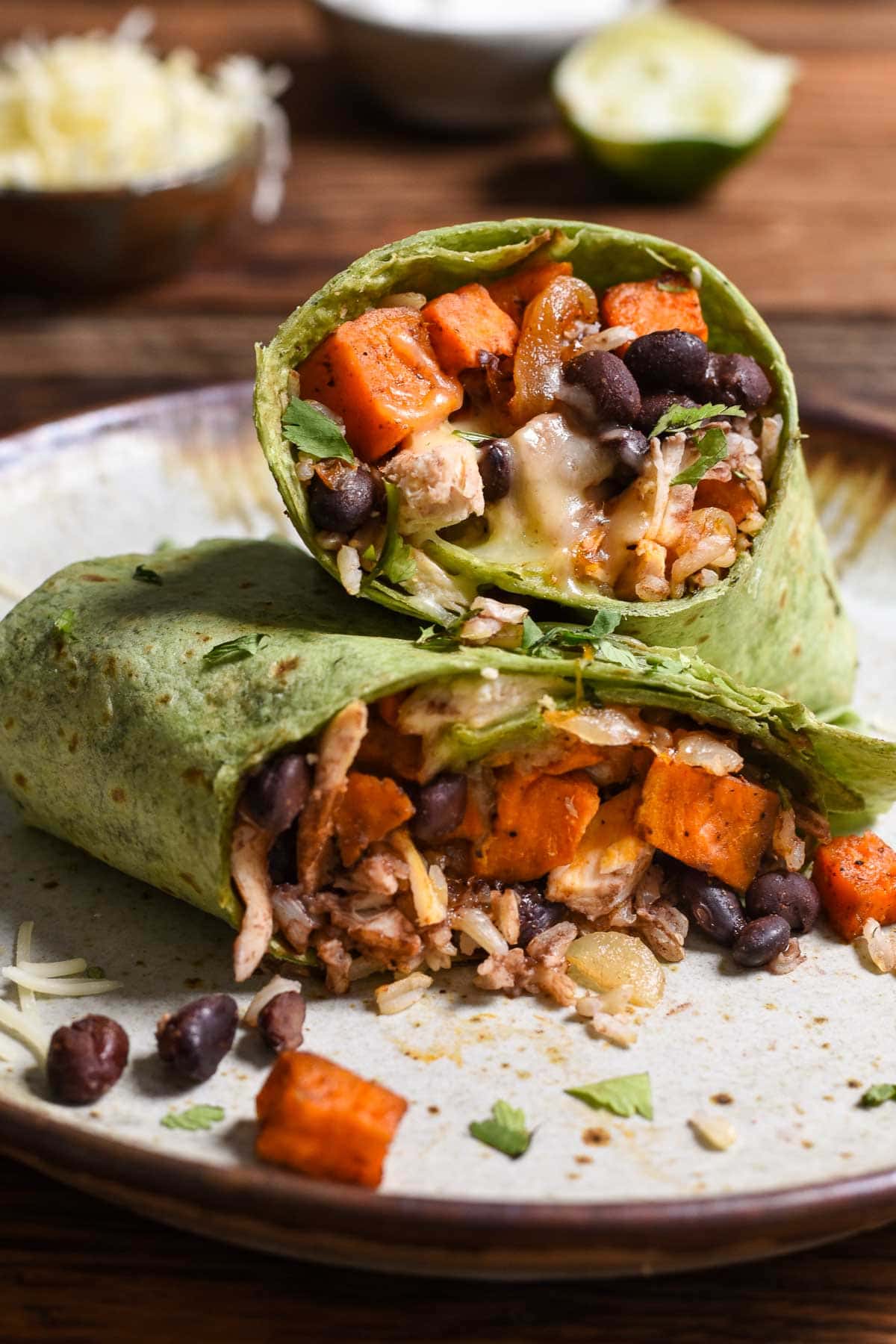 Sweet Potato Black Bean Burritos are loaded with protein, melty cheese, spicy black beans, and smoky maple sweet potatoes. The perfect freezer meal!