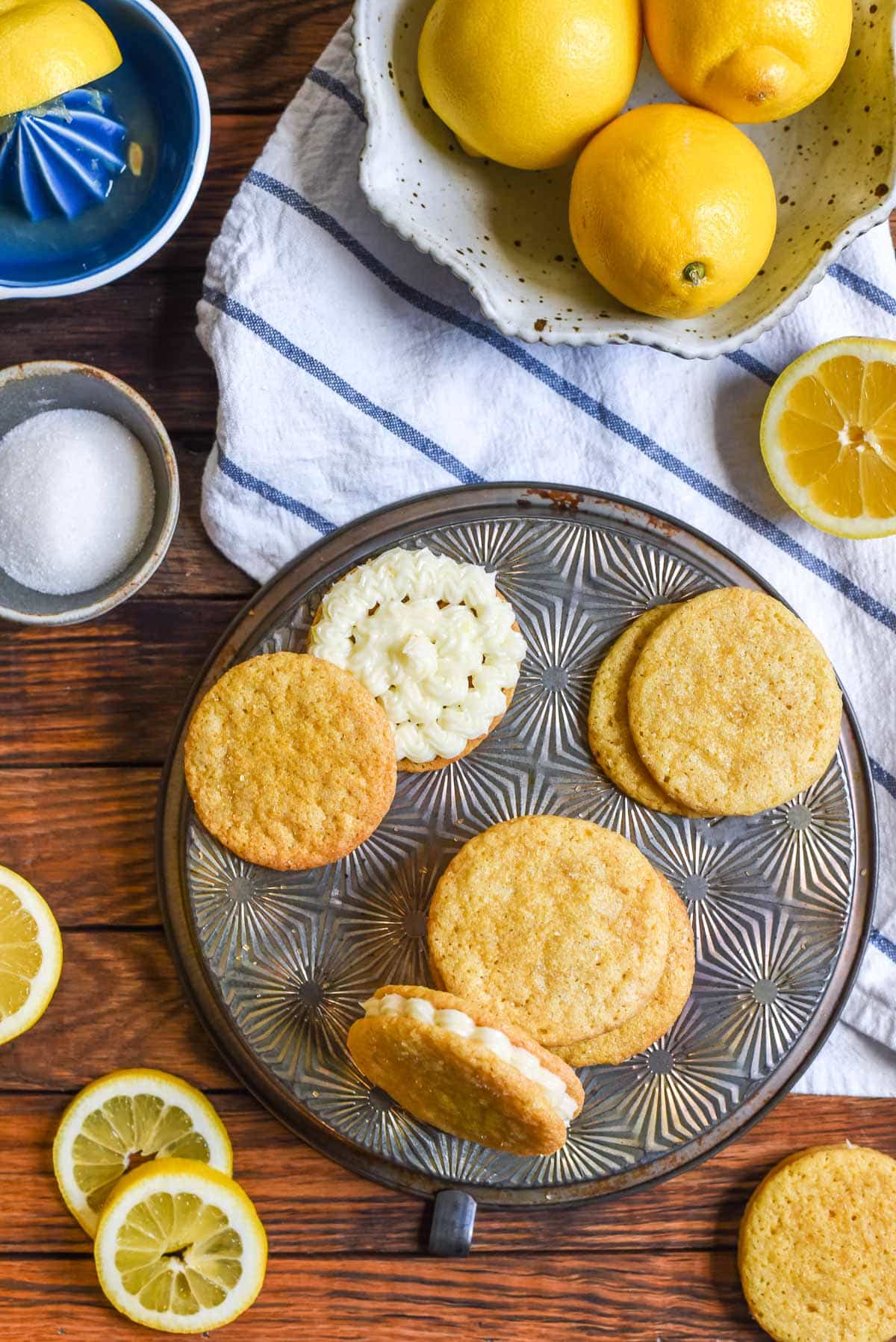 Lemon Sandwich Cookies are a lemon lovers dream! Soft and chewy lemon sugar cookies are sandwiched around a zingy lemon cream cheese filling for the ultimate spring cookie!