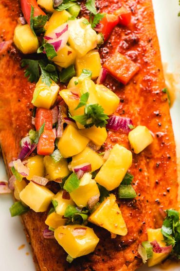 Mango Salsa on top of a seasoned and grilled salmon filet.