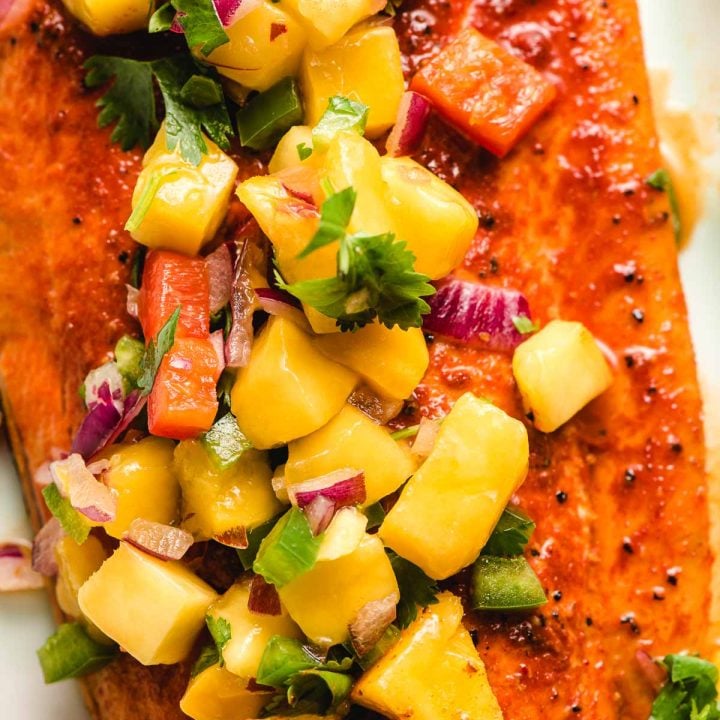 Mango Salsa on top of a seasoned and grilled salmon filet.