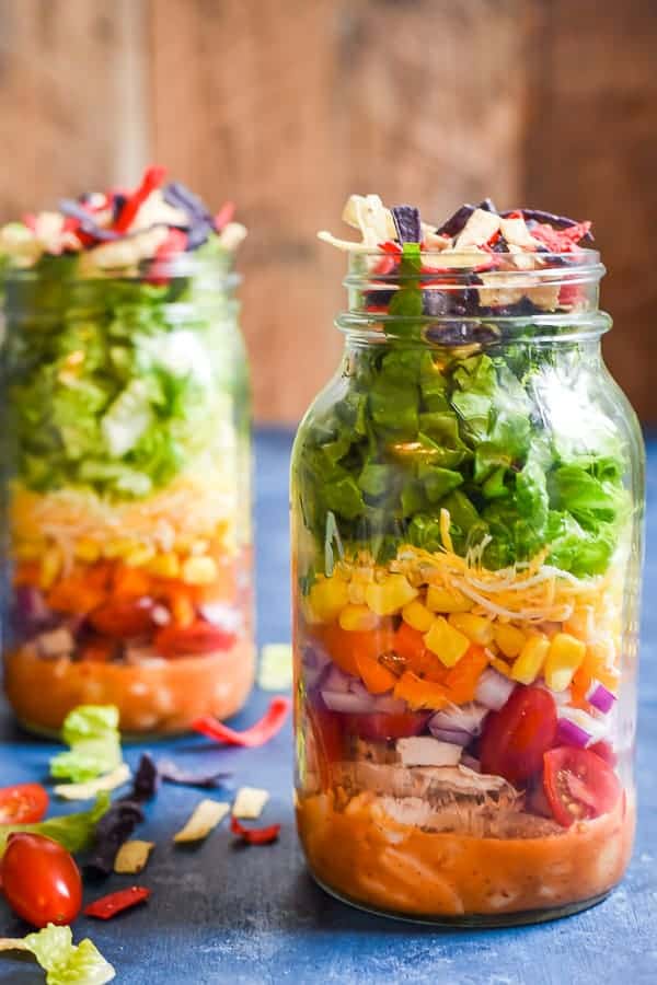 These Mason Jar Taco Salads are loaded with chicken, fresh crispy vegetables, and a smoky honey vinaigrette for the best grab-and-go lunch.