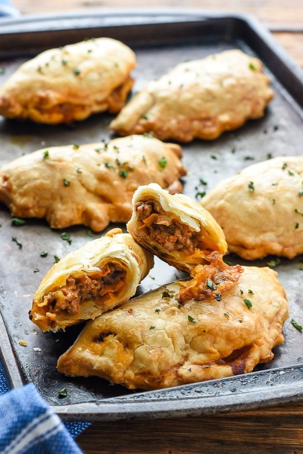 These Cheesy Ground Beef Empanadas--think tacos meets Hot Pockets--only a thousand times better!