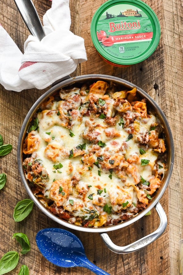This One Pot Tortellini and Sausage Skillet is packed with veggies, tomato sauce, and a melty mozzarella cheese topping.
