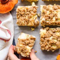 Peach Cobbler Cheesecake Bars combine two of my favorite desserts for an awesome summer treat.