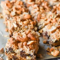 Classic 7 Layer Magic Bars made with chocolate, caramel, coconut, and cashews.