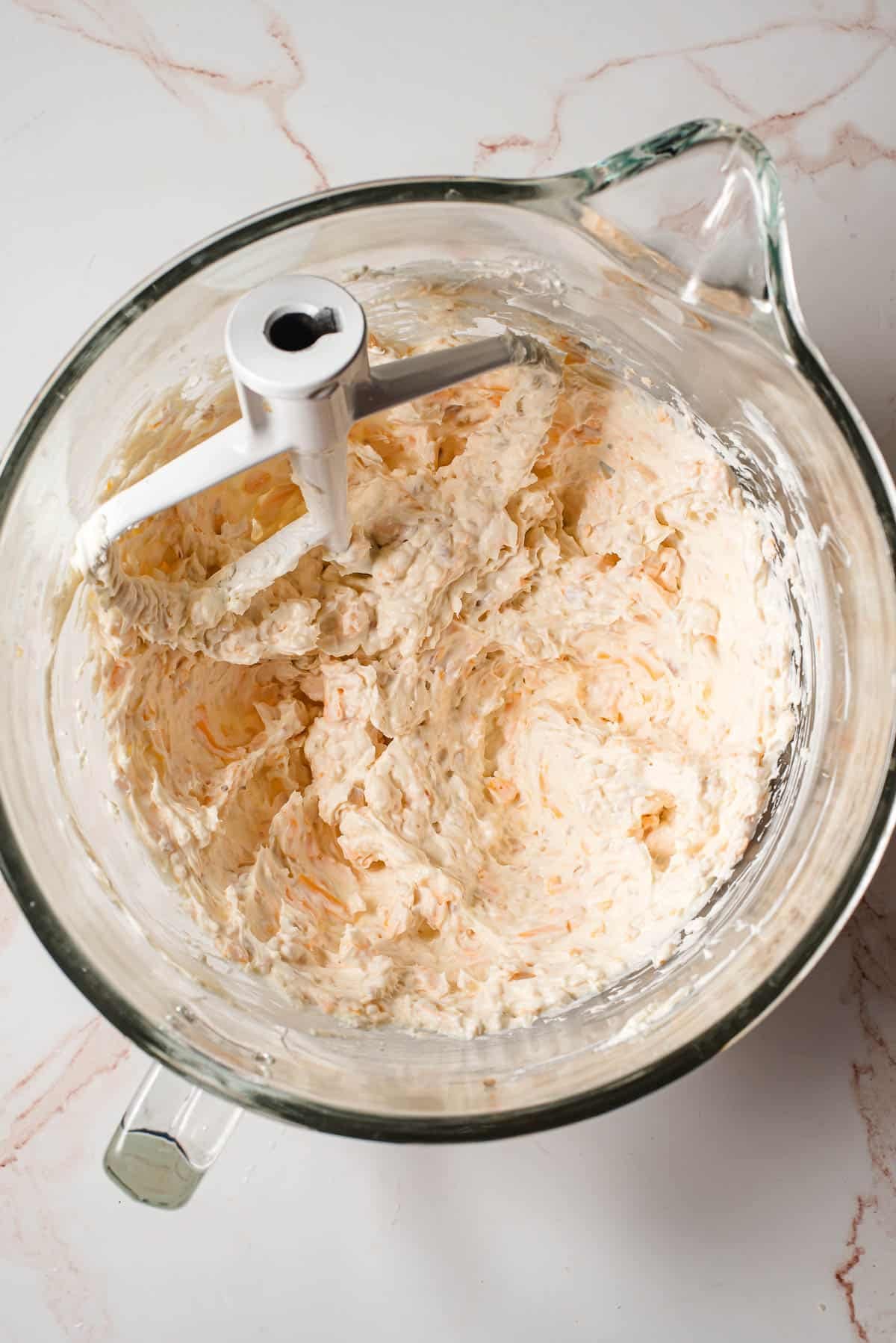 Cream cheese, sour cream, cheddar, cheese, and parmesan cheese beated together.