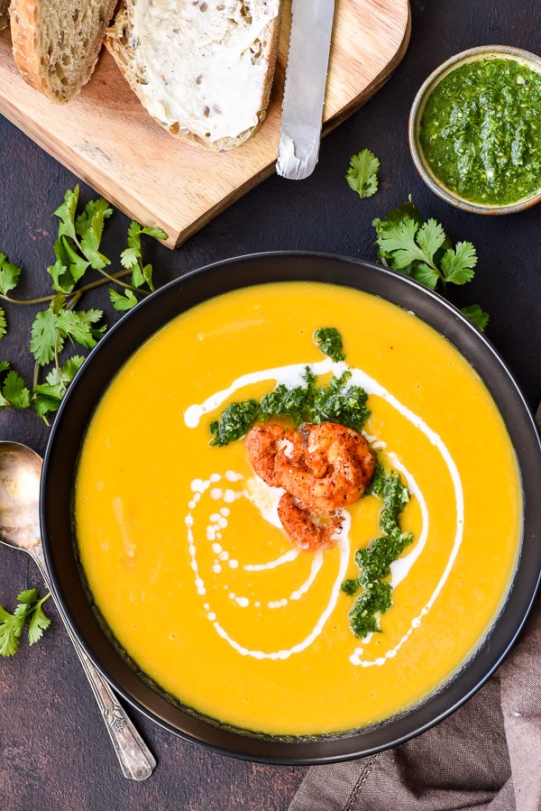 Roasted Butternut Squash Soup topped with shrimp and herb sauce