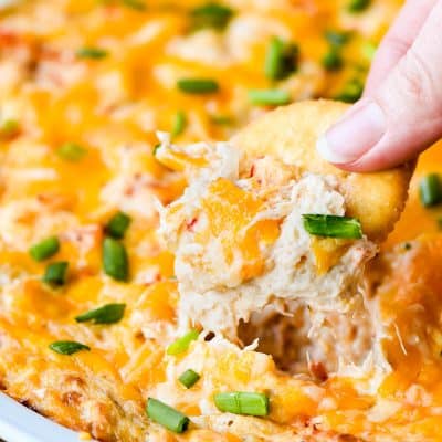 Cheesy crab dip on a Ritz cracker.