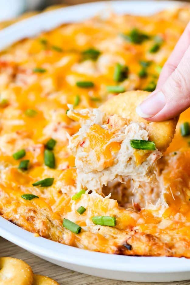 Cheesy crab dip on a Ritz cracker.