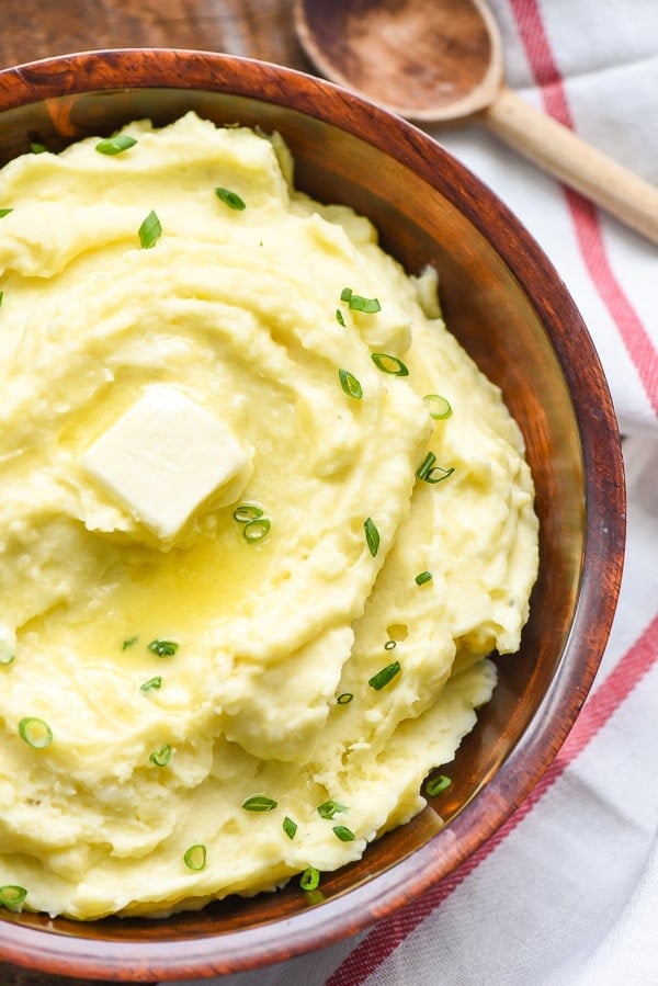 Creamy mashed potatoes with melting butter on top
