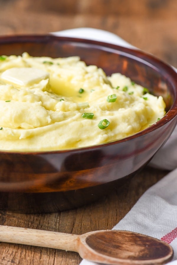 Mashed potatoes in a bowl with butter in top