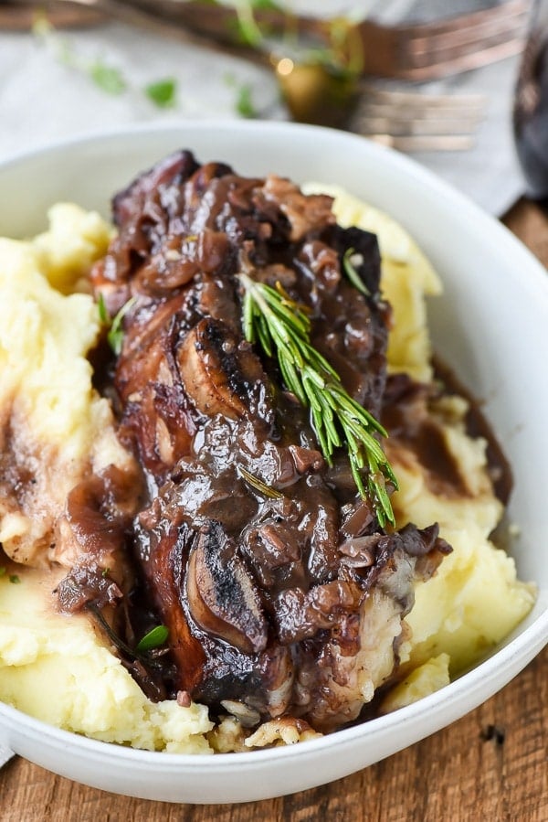 Red Wine Braised Short Ribs with rosemary sprig on top