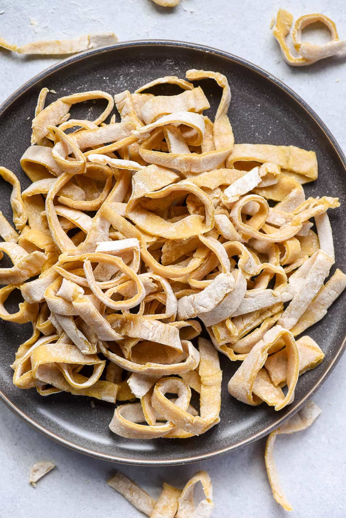 Pile of homemade egg noodles on a plate