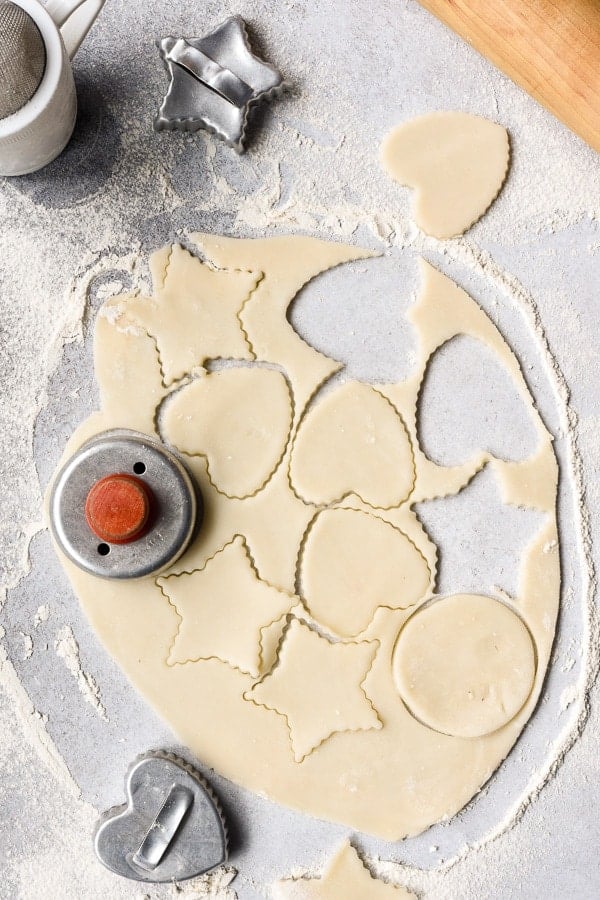 Pie dough with cookie cutter shapes cut out