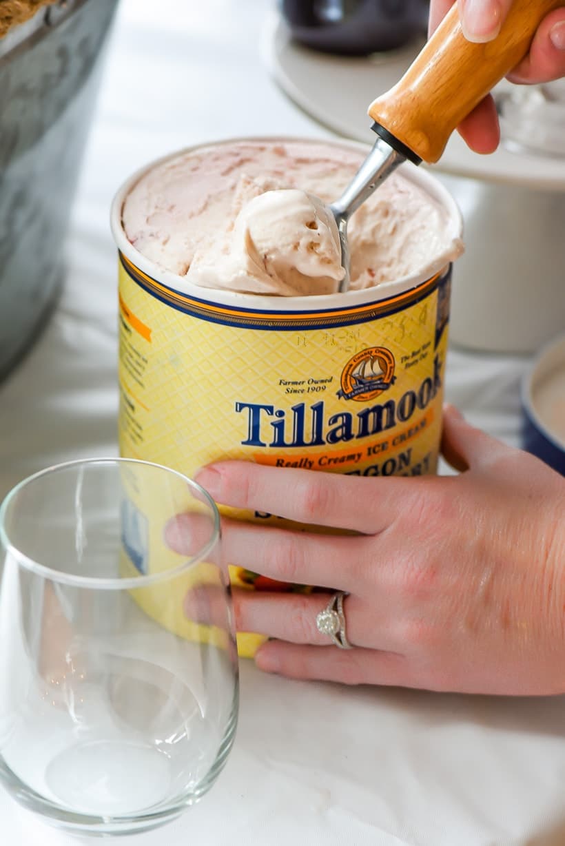 Scooping Tillamook strawberry ice cream into a glass