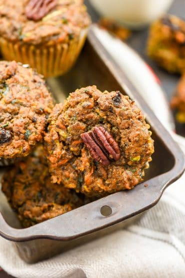 Close up of Carrot Zucchini Muffins with a pecan on top
