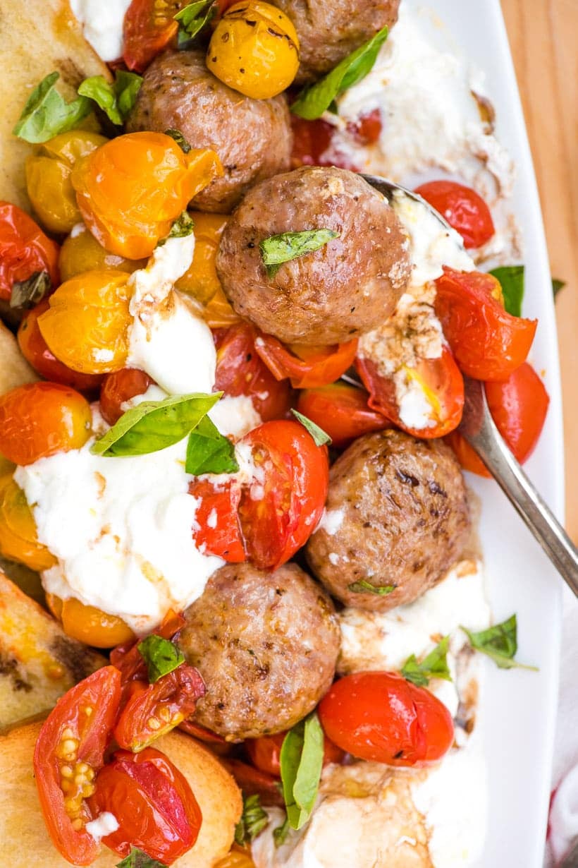 Roasted Tomatoes and Burrata with Meatballs on a platter