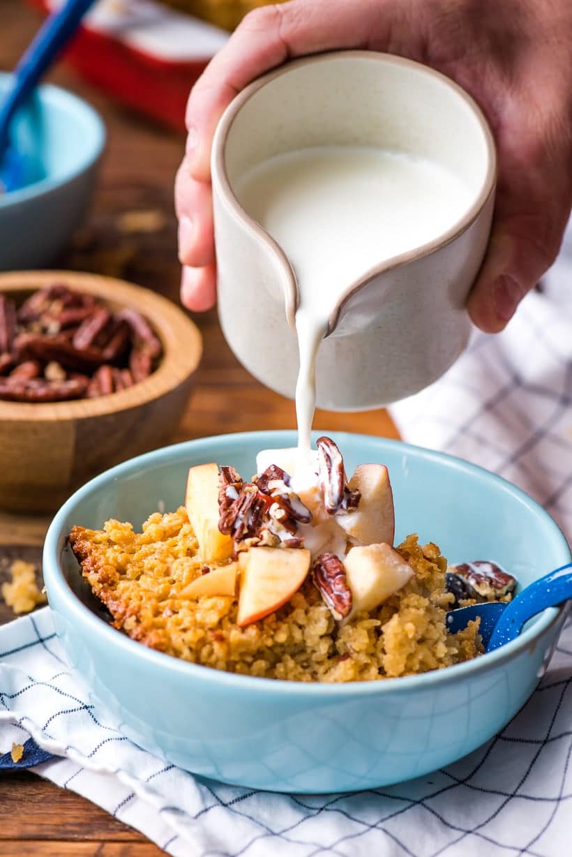 Amish Baked Oatmeal with milk pouring into a bowl