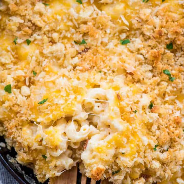 Creamy Baked Mac and Cheese with a wooden spoon