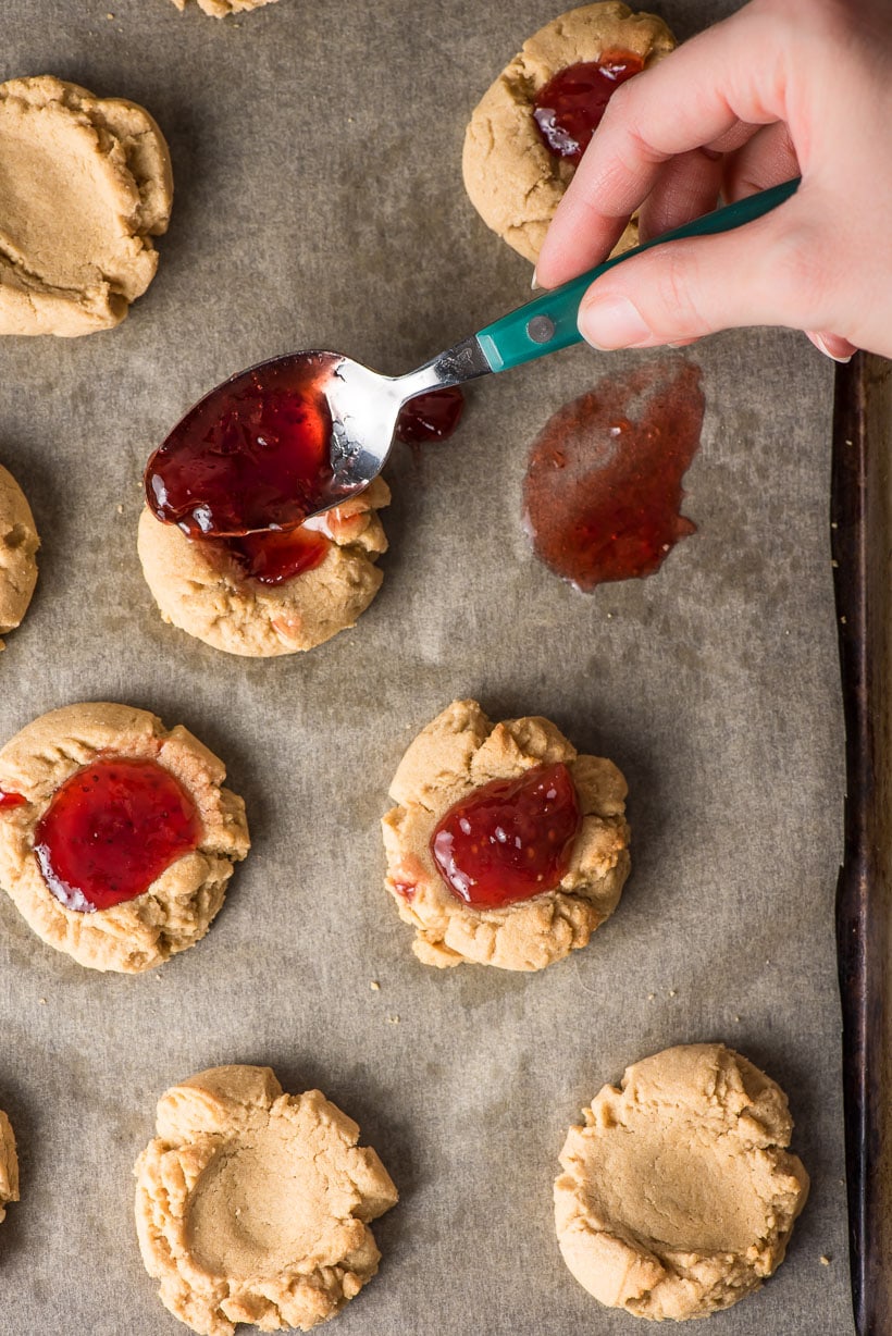 peanut butter thumbprint cookies filled with berry jam