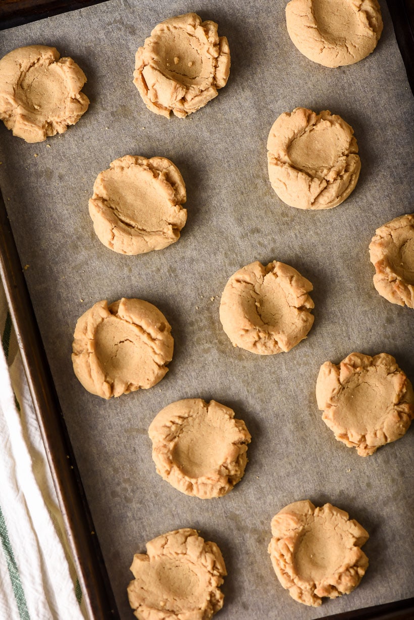 Peanut Butter Thumbprint Cookies on a sheet pan