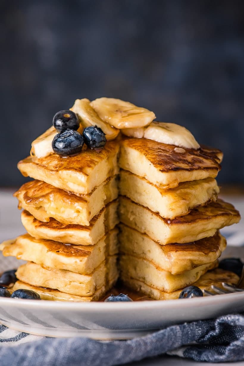 Ricotta pancakes stack with wedge cut out of the center