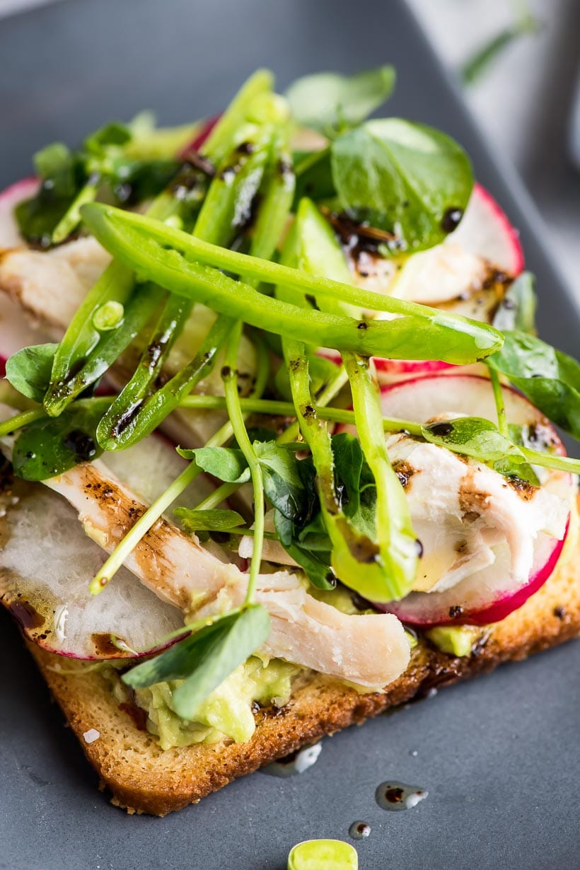 Avocado Toast with Radishes, Chicken, and Peas with drizzle of balsamic vinegar