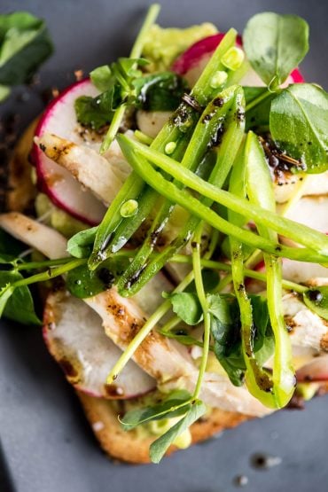 Avocado Toast with Radish, Chicken, and Peas close up