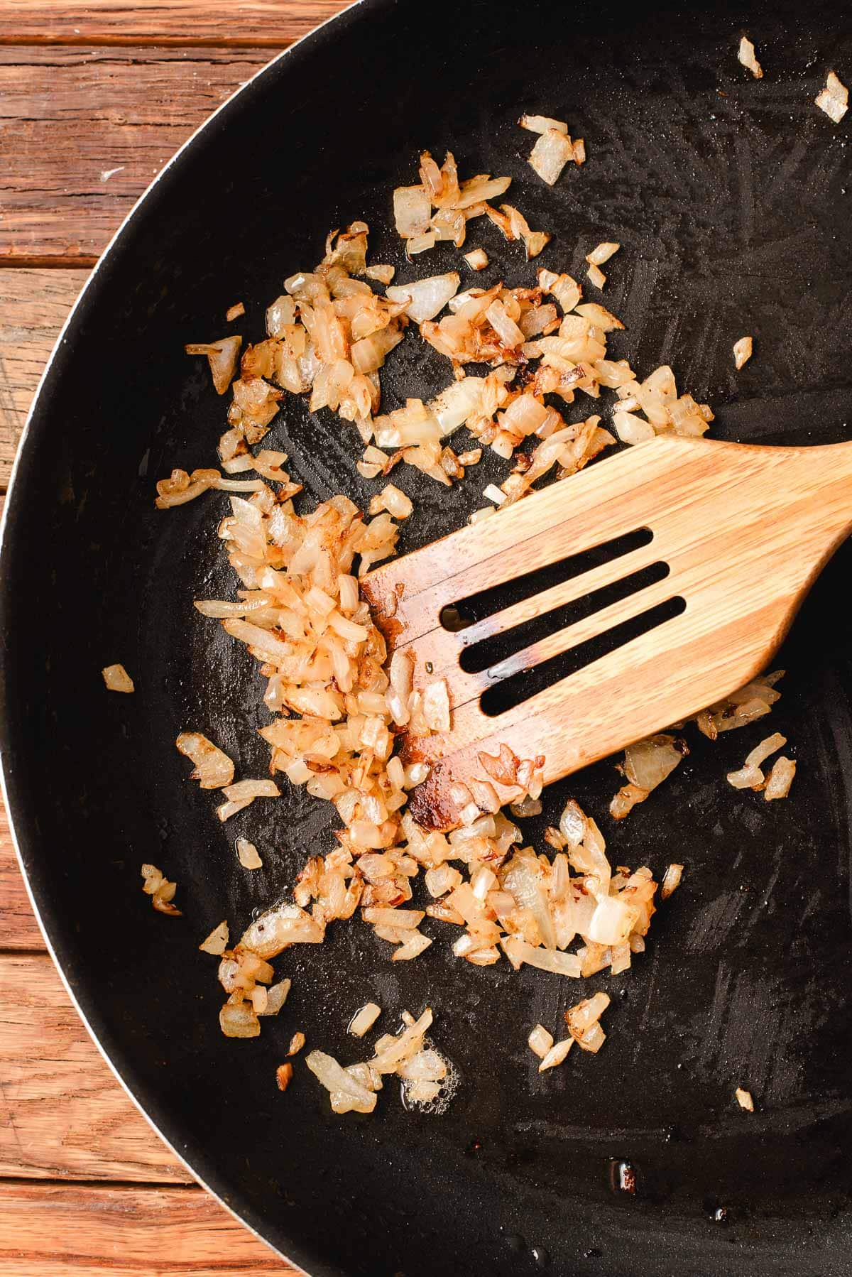 Sauteed onions in a pan.