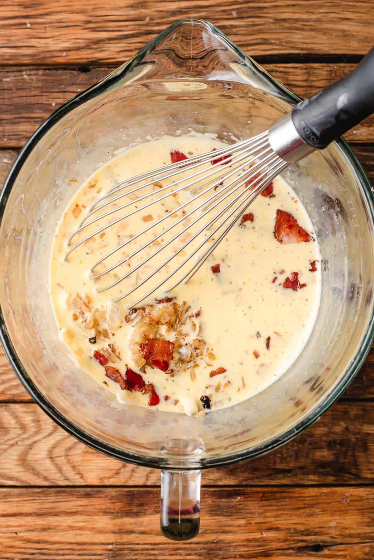 Bacon, onions, and cheese whisked into egg custard.