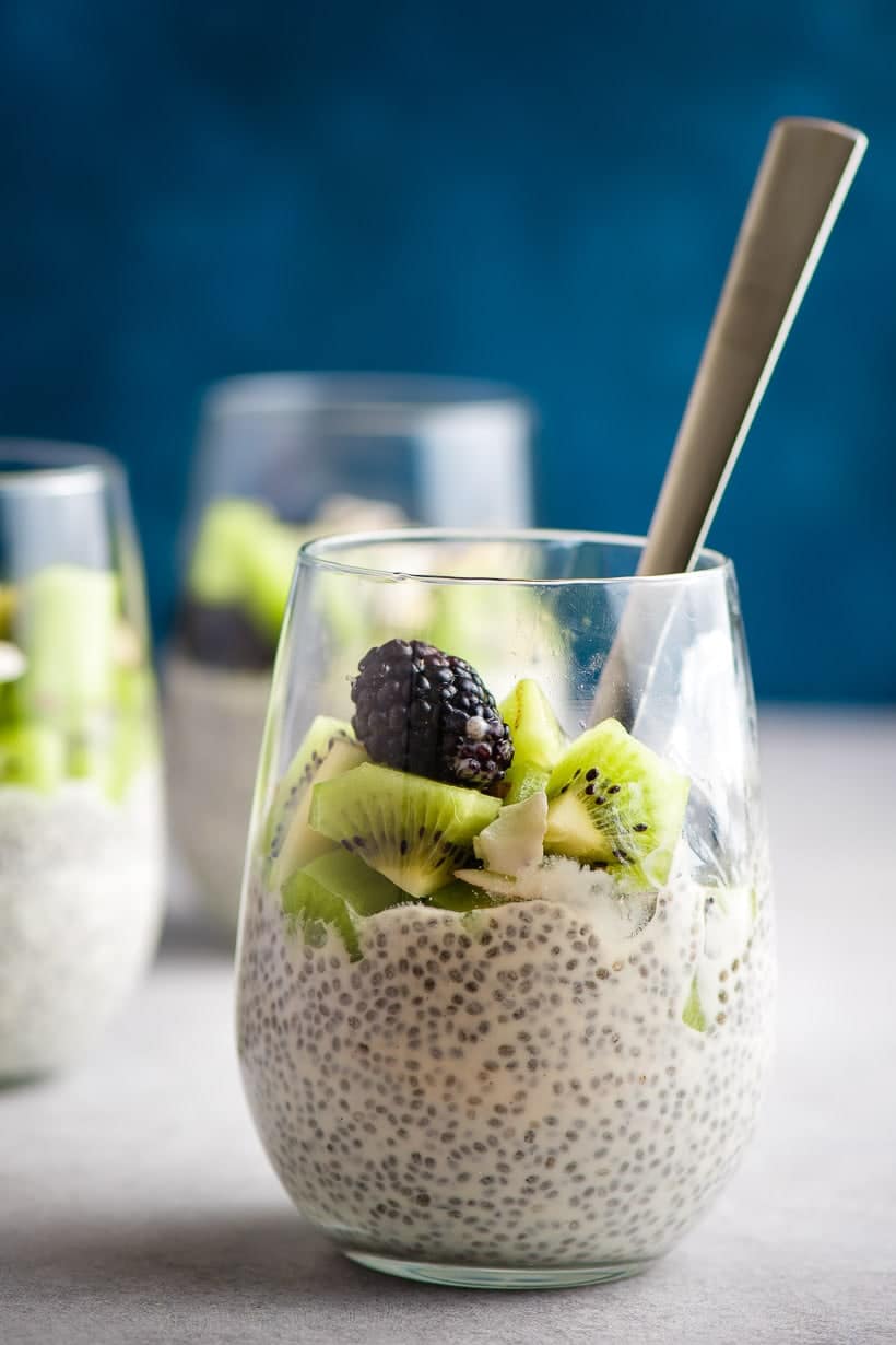 Overnight chia pudding in a glass with a spoon