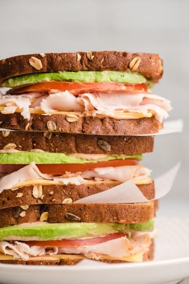 Stack of three turkey avocado sandwiches