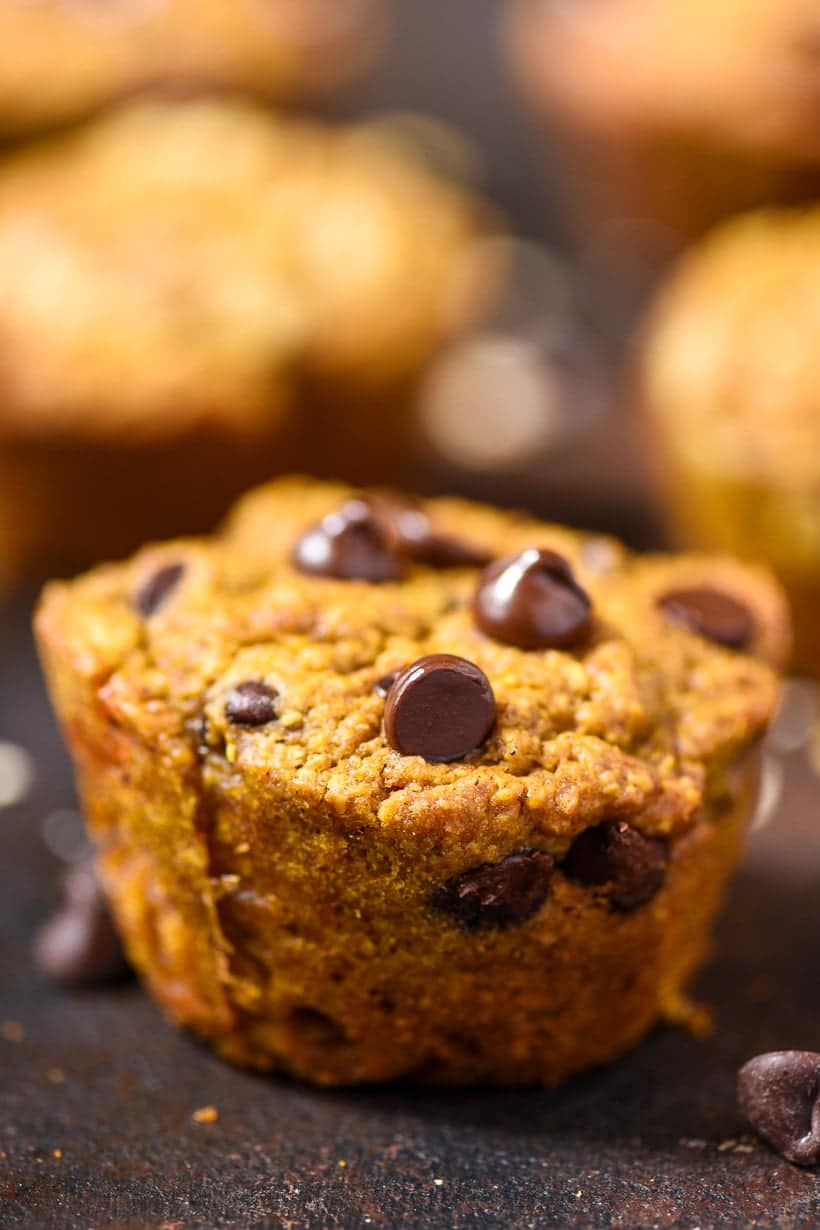pumpkin chocolate chip muffin on a black surface