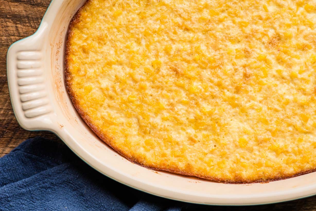 baked corn casserole in an oval dish